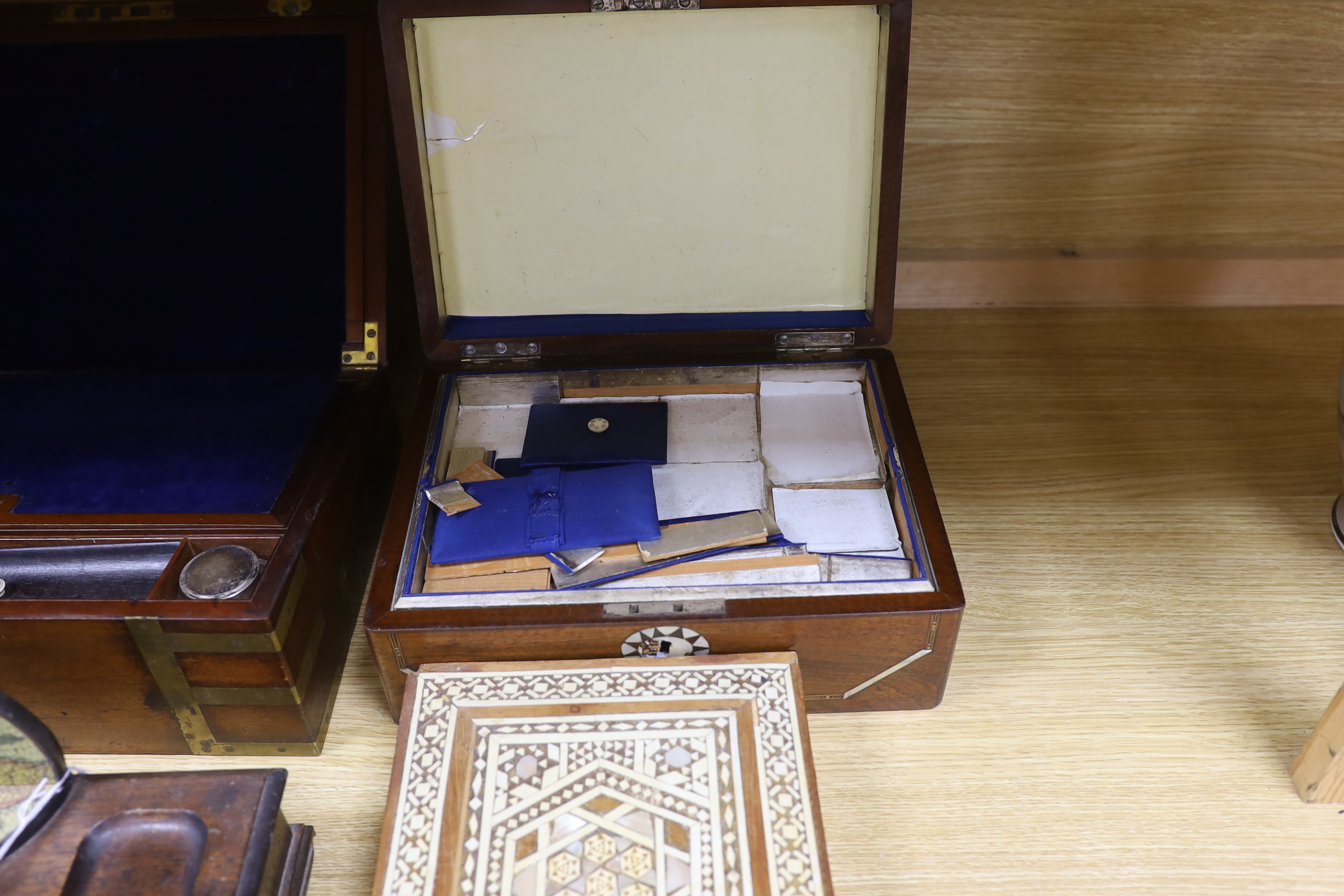 Four various boxes - a brass bound writing slope, a Moroccan inlaid box, mother of pearl inlaid sewing box and another